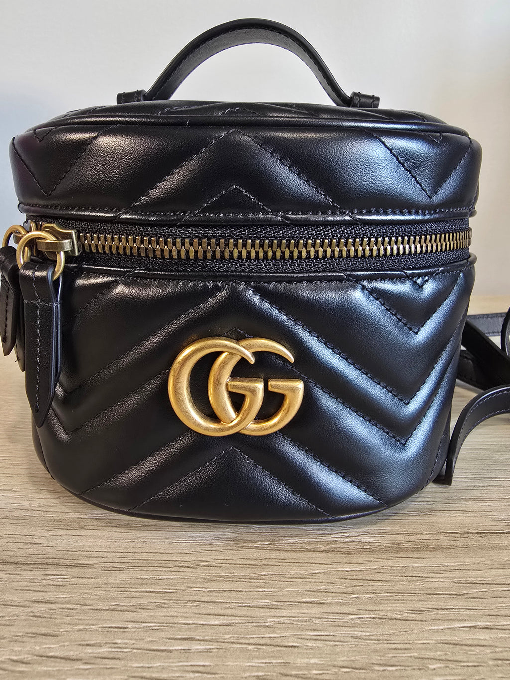 Gucci GG Marmont Mini Round Backpack Black Matelassé Leather Gold Hardware